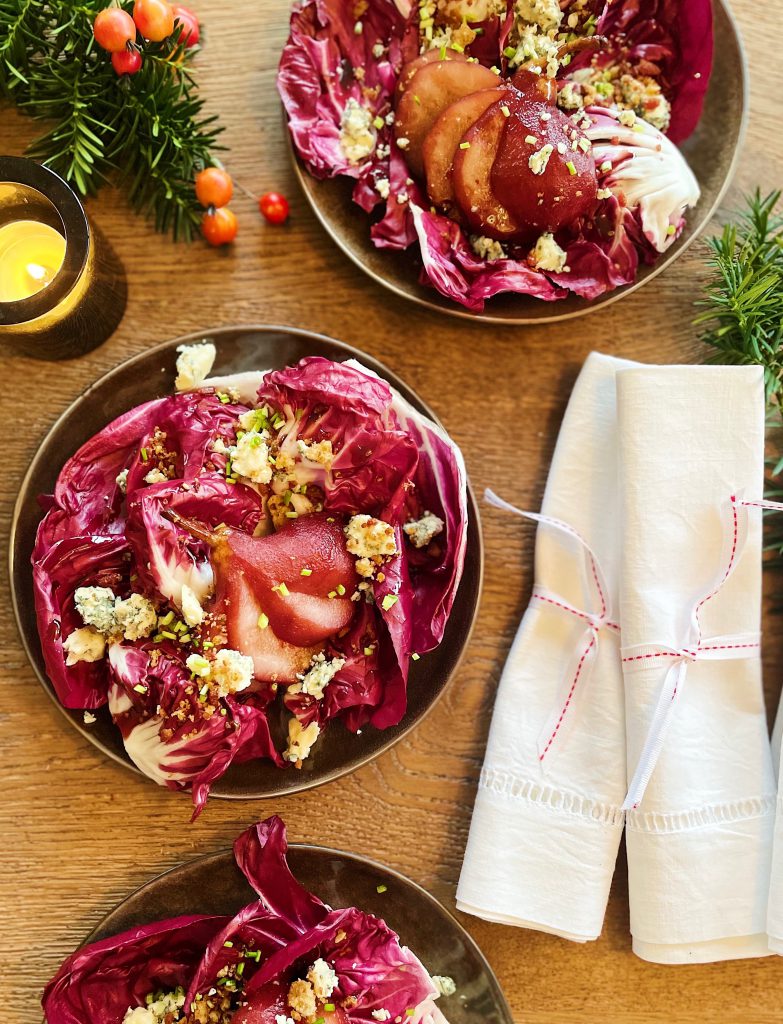 christmas salad with poached red wine pears and blue cheese
